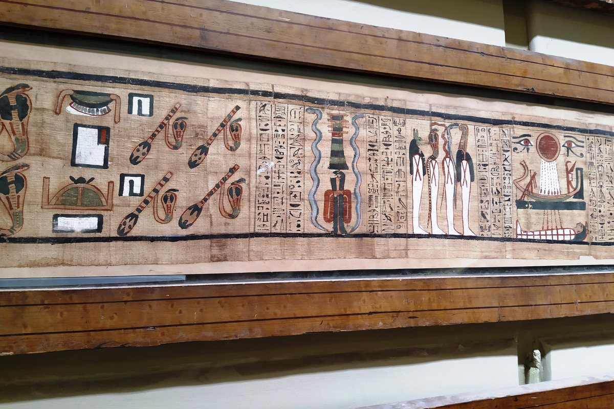 Long illustrated ancient Egyptian papyrus displayed in the Egyptian Museum in Cairo